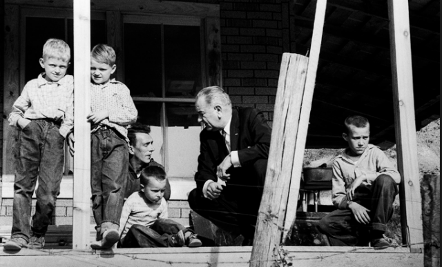 President Lyndon Baines Johnson visit to Tom Fletcher's home in Kentucky was part of a tour of poverty stricken areas of the U.S. (Photo by Walter Bennett/Time & Life Pictures/Getty Images).