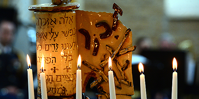 Six memorial candles are lit to remember the 6 million Jews killed during the Holocaust during a 70th anniversary remembrance in Denver of the Allied liberation of concentration camps. Credit: Helen H. Richardson/The Denver Post