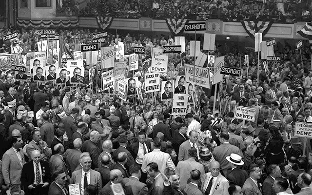 Delegates crowd down the center aisle at the 1948 Republican National Convention in Philadelphia during a demonstration for Gov. Thomas E. Dewey. Dewey was the last Republican presidential candidate to be nominated in a multi-ballot contest; he won on the third ballot. Photo credit: AP photo