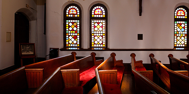 Photo of empty pews in a church