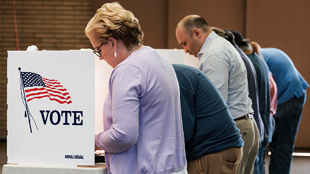 Voters cast their ballots at a fire station in Alhambra, California, on Nov. 8, 2016. (Ringo Chiu/AFP/Getty Images)